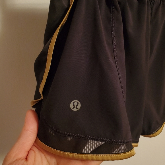 Lululemon Super Squad shorts. Black and gold. Size 6. Built in liner. - Picture 6 of 12